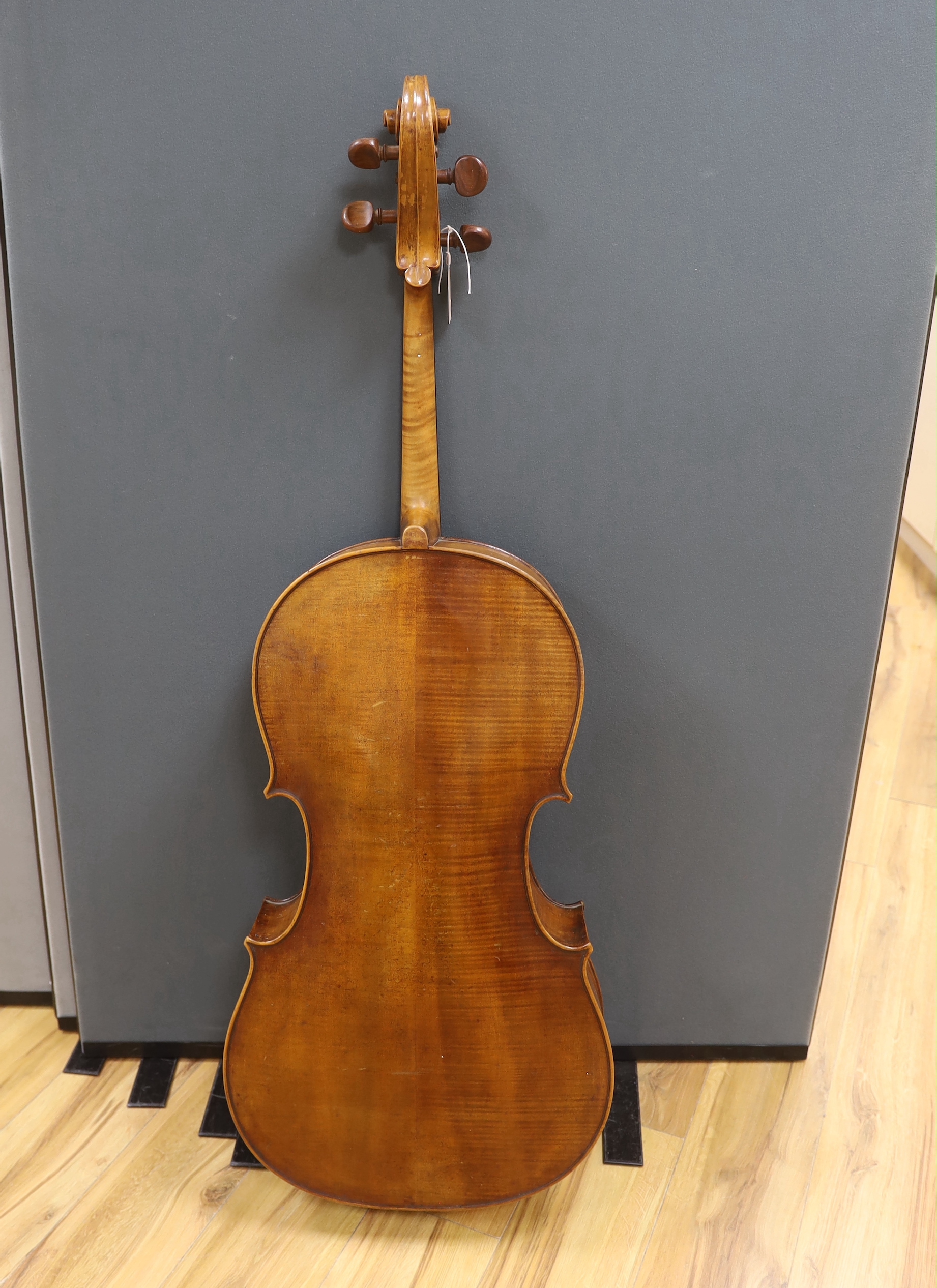 An early 20th century cello, back measures 76cm